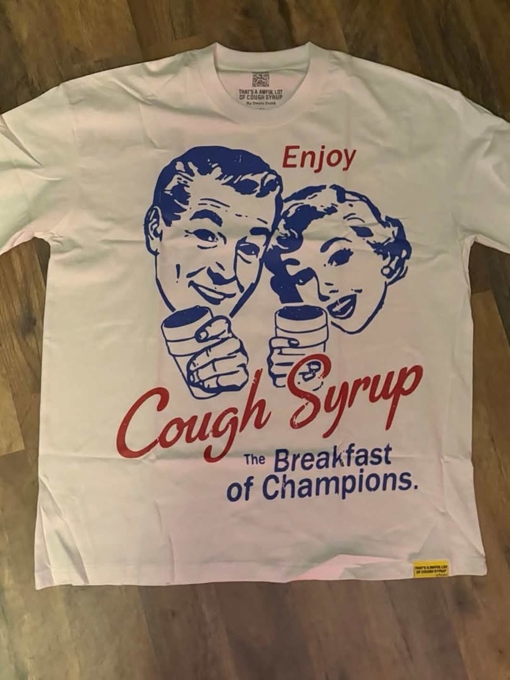 Enjoy Cough Syrup Graphic Tee- White with Red & Blue Print